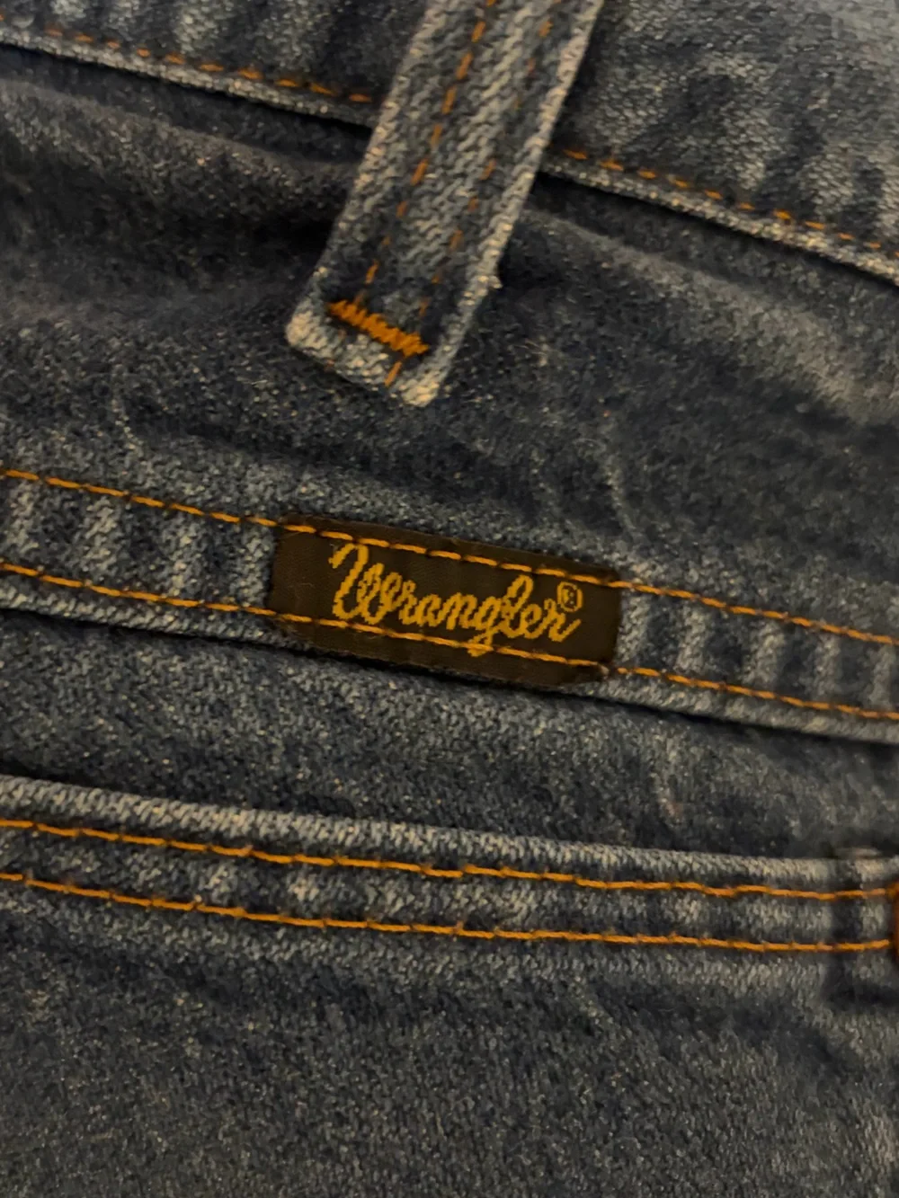 Wrangler Relaxed Fit Denim Jeans in Medium Blue with Orange Stitching